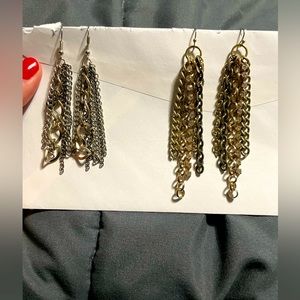 Two pairs of earrings.   One silver. One gold.